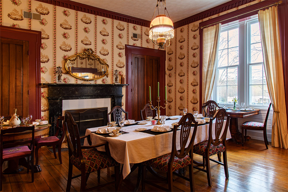 Elegant dining room inside the historic Denny House, perfect for rehearsal dinners and private events.